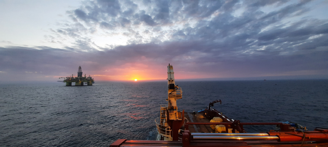 Ship and rig at sunset